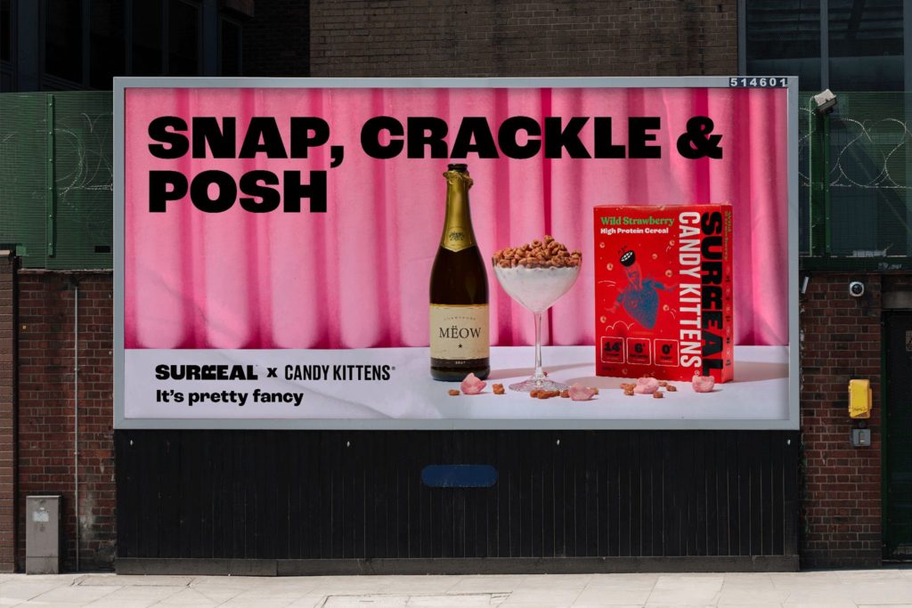 Image of vibrantly designed billboard displaying a picture of a champagne bottle, cereal in a glass and a cereal box.
