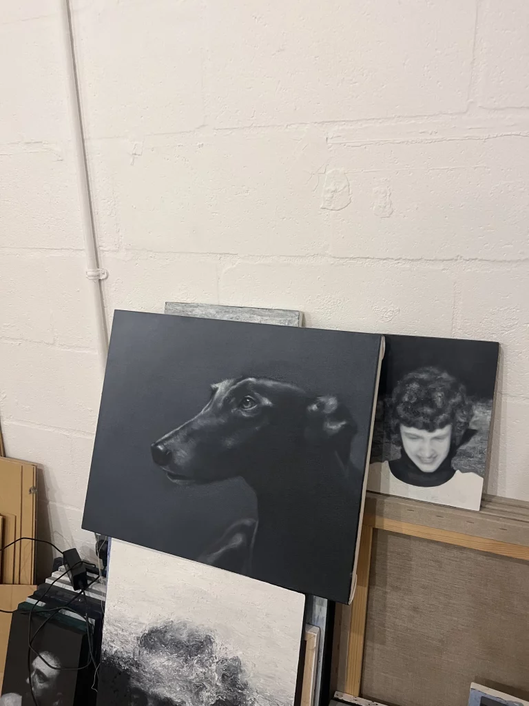 Painting of a greyhound's head.