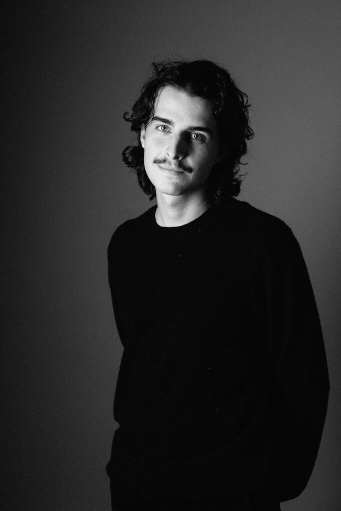 Ricardo Markin, founder of Greyhound Creative, Suffolk's Creative Agency posing for a portrait headshot.